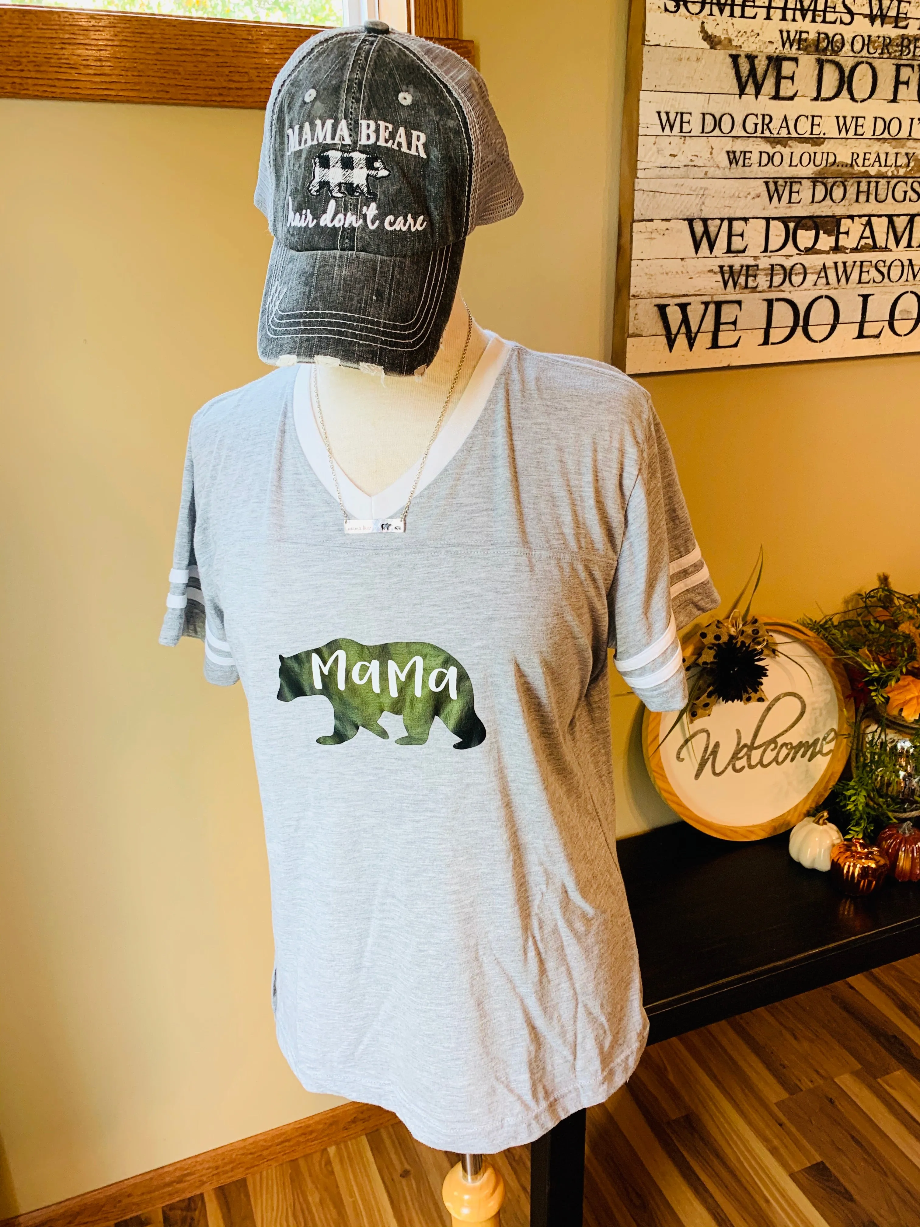 Hats, shirts, necklaces { Mama bear hair don't care. Gray with black and white buffalo plaid bear. Embroidered. Necklaces silver with option of bears. T-shirts XS - XL.